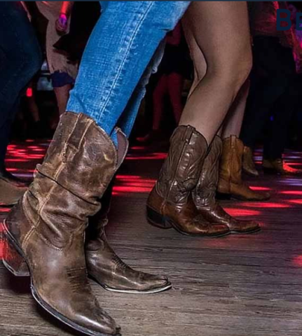 People dancing in cowboy boots. 